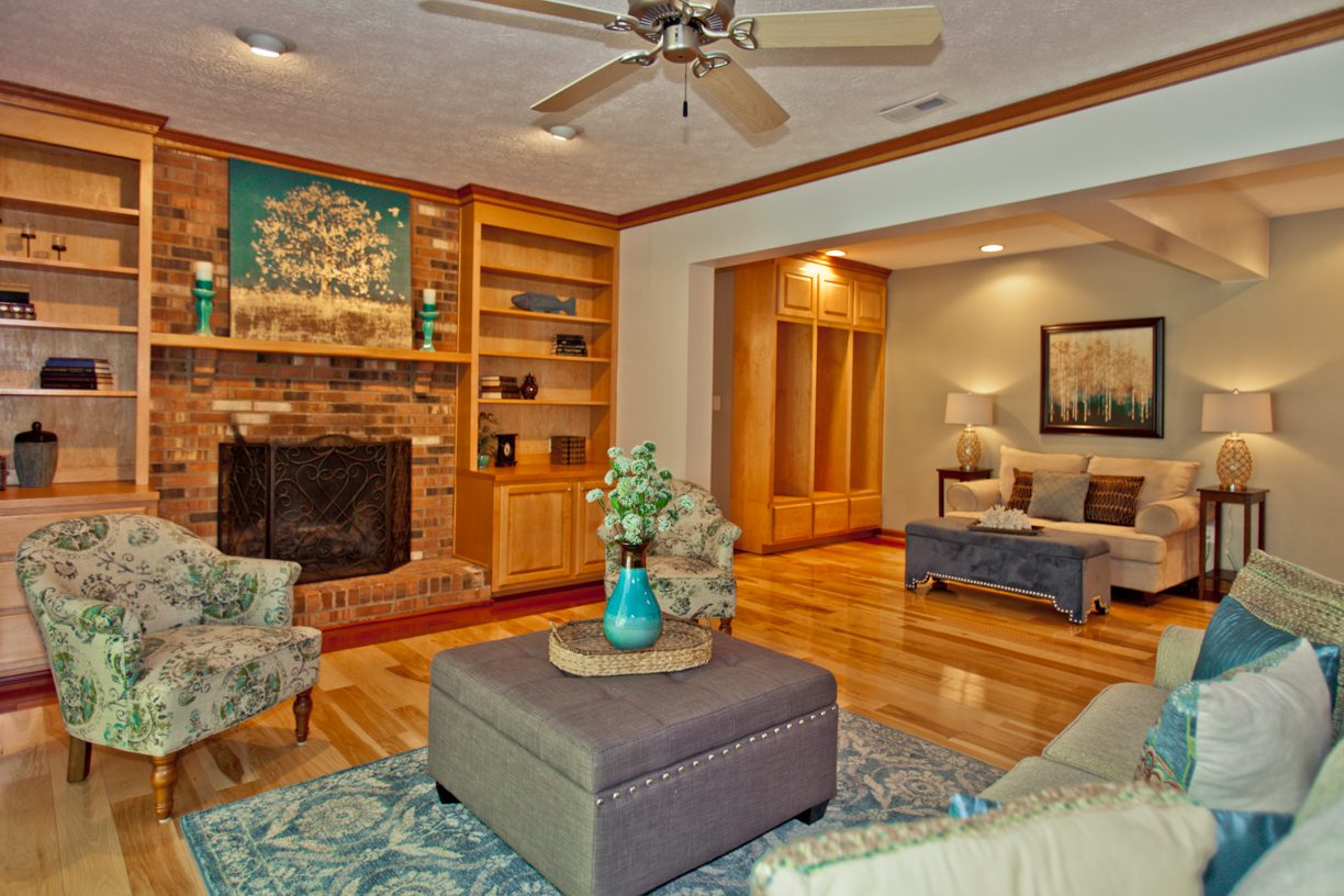 A living room with a fireplace and a couch